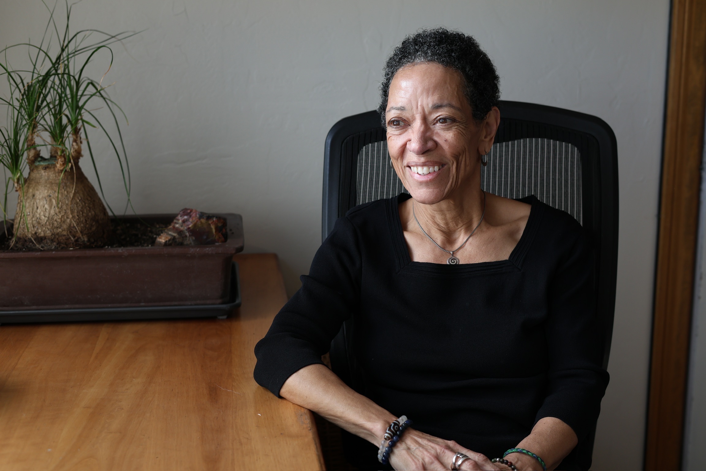 Sarita Evans, the Entrepreneur Doula, seated at a worktable