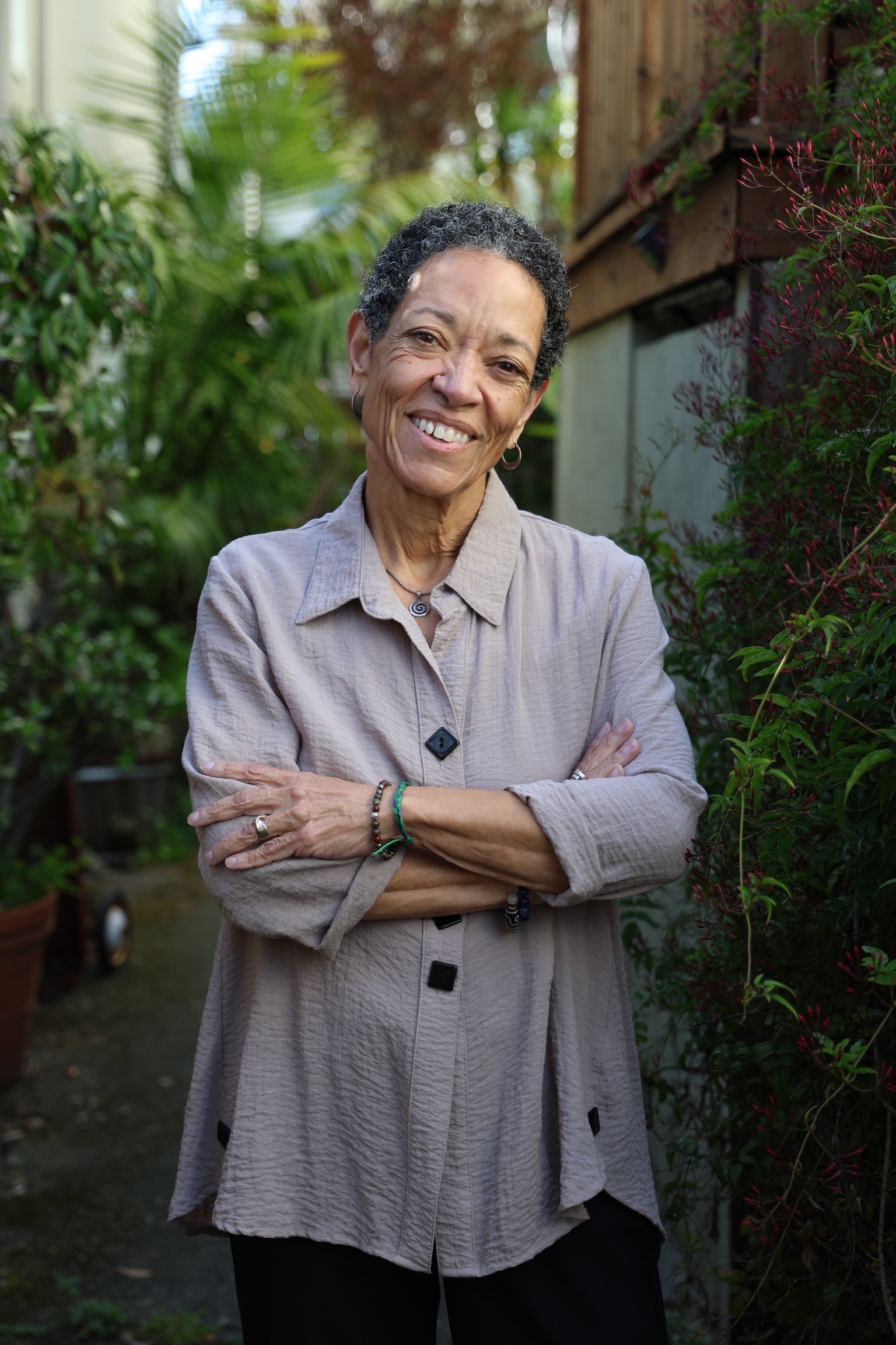 Sarita Evans smiling outdoors